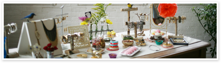 Tablescape of Chloe + Isabel Jewelry set out for a trunk show.